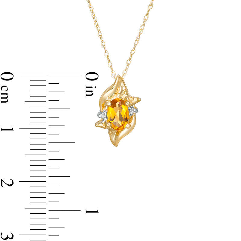 Oval Citrine and Natural Diamond Accent Flame Burst Pendant in 10K Yellow Gold