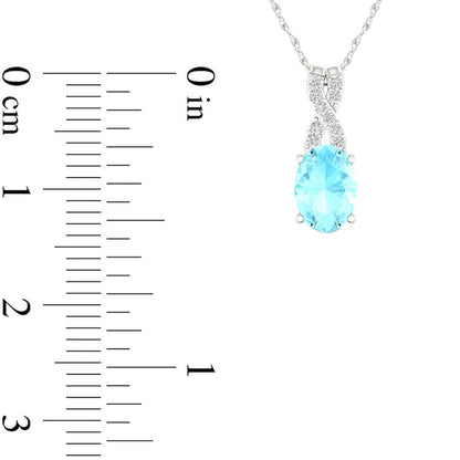 Oval Aquamarine and 0.05 CT. T.W. Natural Diamond "X" Drop Pendant in 10K White Gold