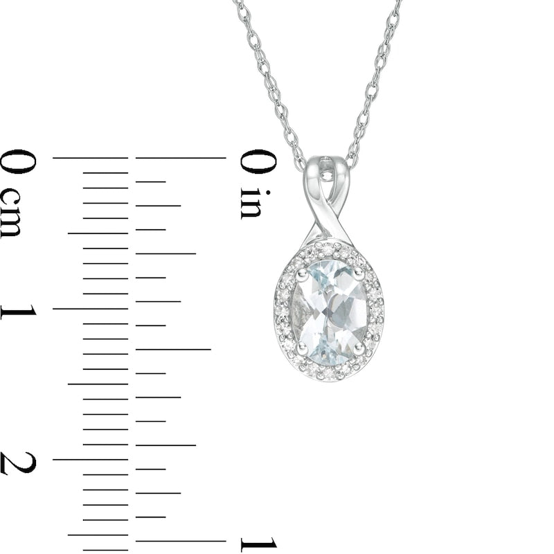 Oval Aquamarine and 0.07 CT. T.W. Natural Diamond Frame Pendant in 10K White Gold