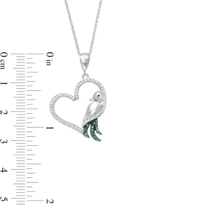 0.17 CT. T.W. Enhanced Blue and White Natural Diamond Tilted Heart with Bird Pendant in 10K White Gold