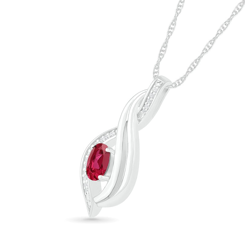 Oval Lab-Created Ruby and 0.05 CT. T.W. Diamond Flame Drop Pendant in Sterling Silver