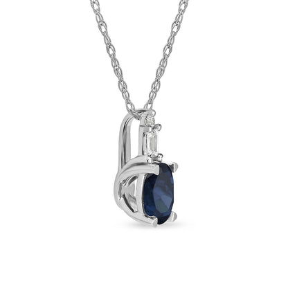 Oval Blue Sapphire and 0.05 CT. T.W. Baguette and Round Natural Diamond Stacked Top Accent Pendant in 10K White Gold