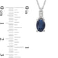 Oval Blue Sapphire and 0.05 CT. T.W. Baguette and Round Natural Diamond Stacked Top Accent Pendant in 10K White Gold