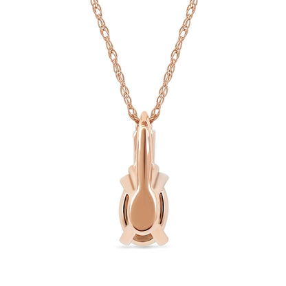 Oval Ruby and 0.05 CT. T.W. Baguette and Round Natural Diamond Stacked Top Accent Pendant in 10K Rose Gold