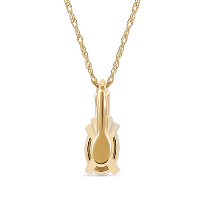 Oval Emerald and 0.05 CT. T.W. Baguette and Round Natural Diamond Stacked Top Accent Pendant in 10K Yellow Gold