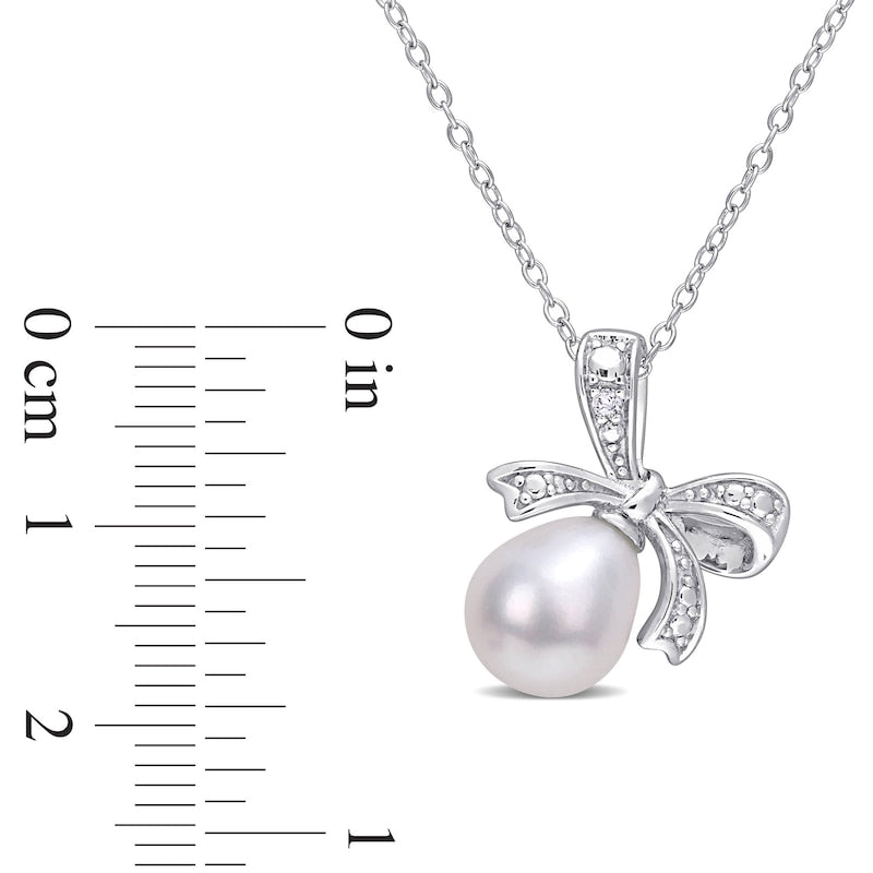 8.5-9.0mm Oval Cultured Freshwater Pearl and Natural Diamond Accent Bow Pendant in Sterling Silver