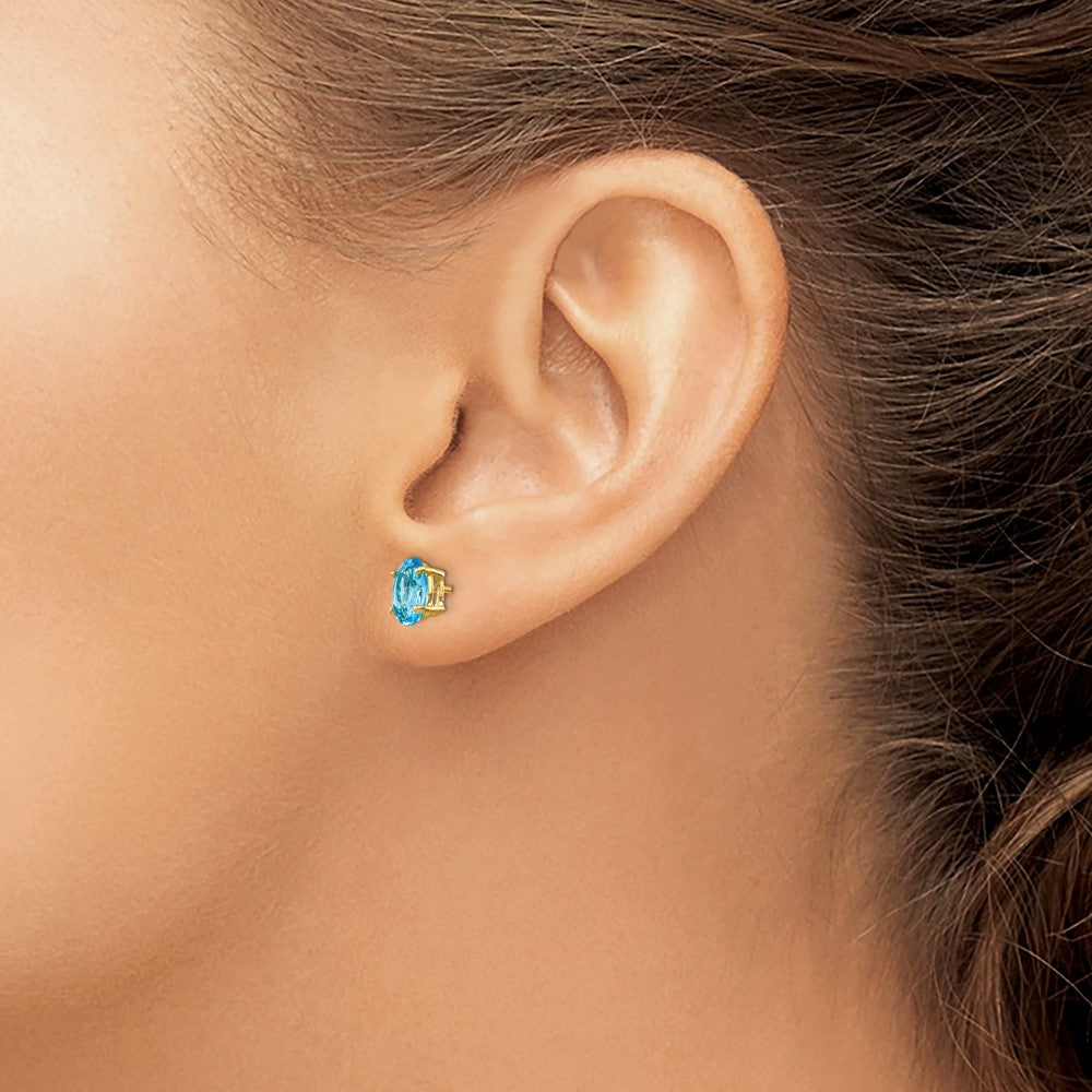 14k Yellow Gold 7x5mm Oval Blue Topaz Earrings