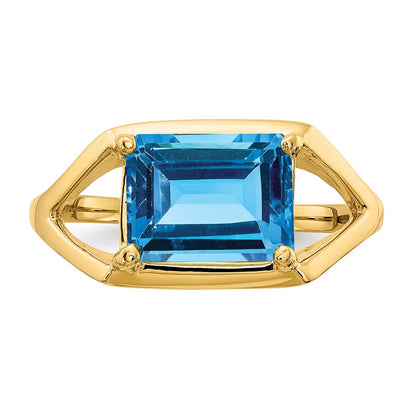 14K Yellow Gold 9x7mm Emerald Cut Blue Topaz ring