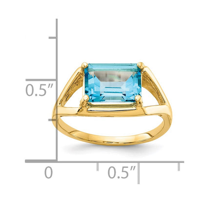 14K Yellow Gold 9x7mm Emerald Cut Blue Topaz ring